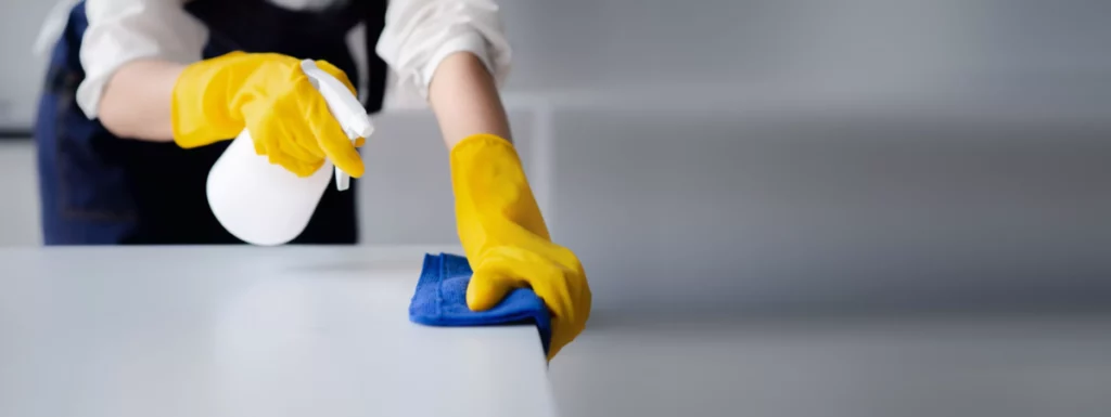 Image of a cleaner cleaning a surface | Commercial Cleaning company in Kent